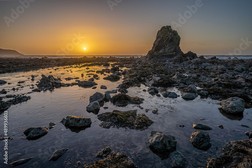 Sunset over Widemouth Bay rocks near Bude photo