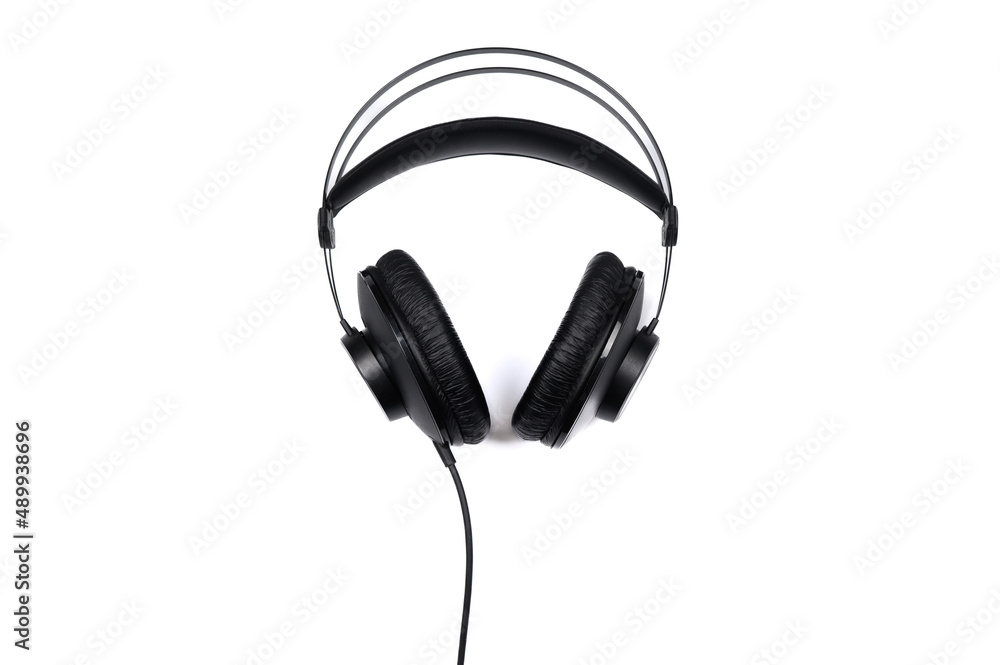 Black headphones isolated on a white background. Top view. Black headphones isolated on a white background. Top view.