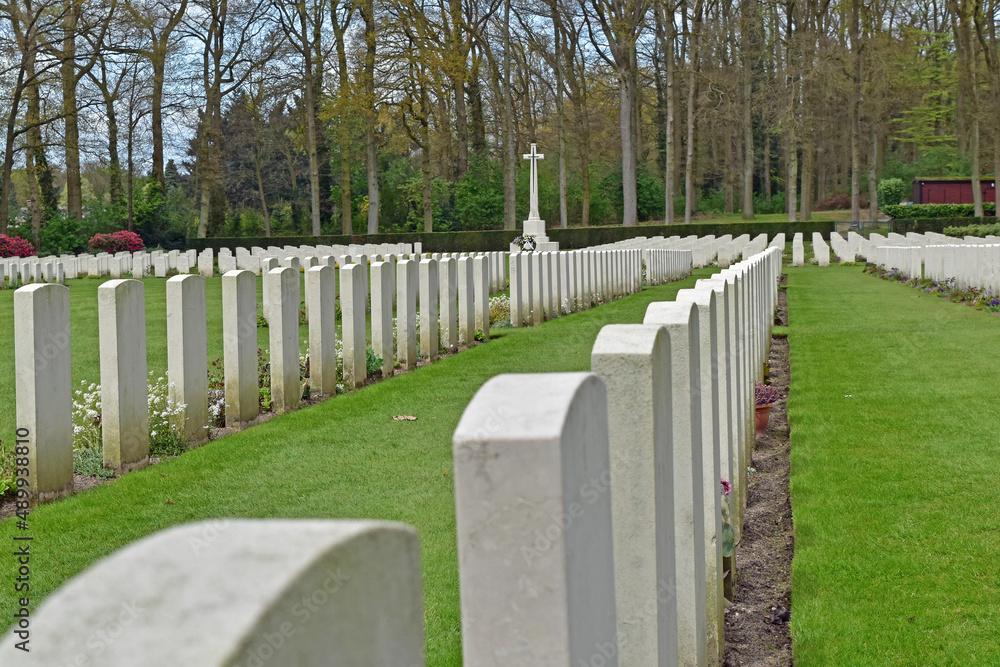Rows of white marble headstones stand in memory of the men lost in battle during WW II at Oosterbeek war cemetery, Arnhem, Netherlands.