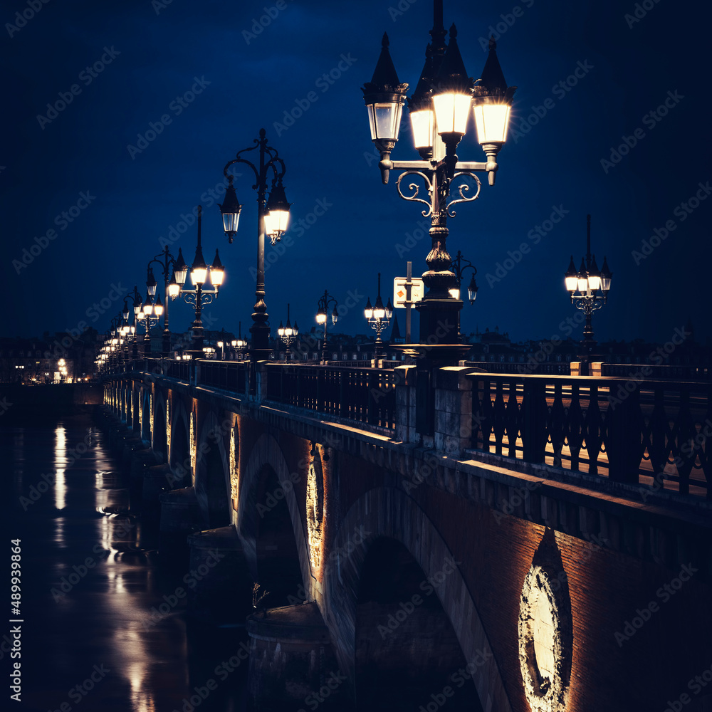 Famous stone bridge in Bordeaux by night