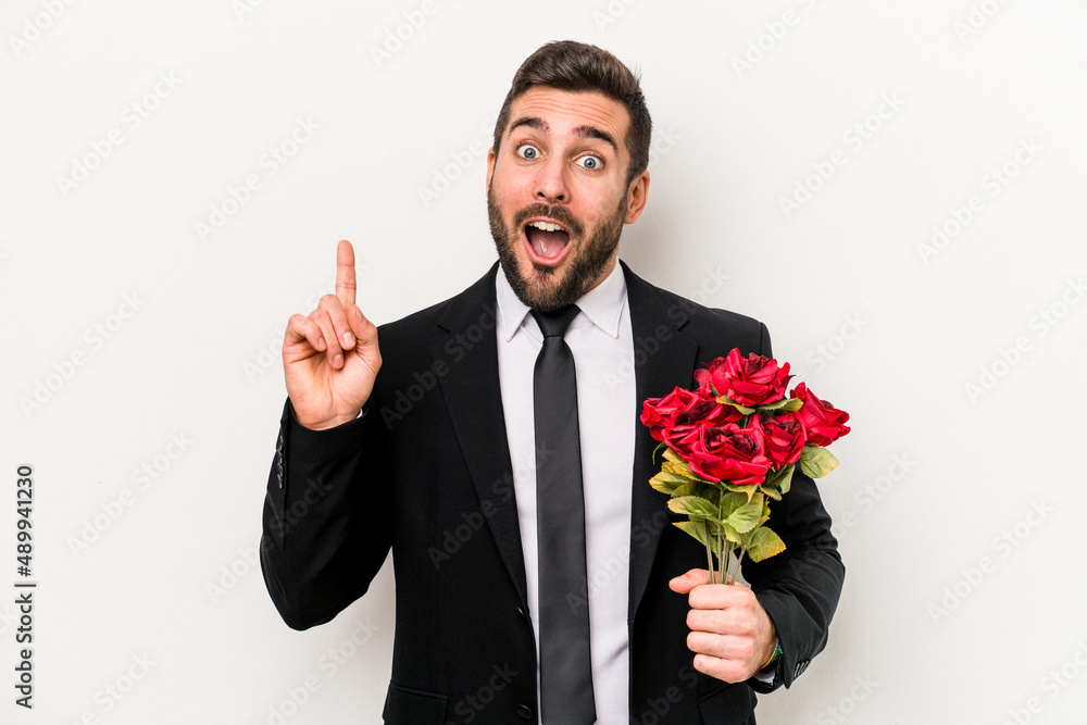 Young caucasian man holding a bouquet of flowers isolated on white background having an idea, inspiration concept. Young caucasian man holding a bouquet of flowers isolated on white background having an idea, inspiration concept.