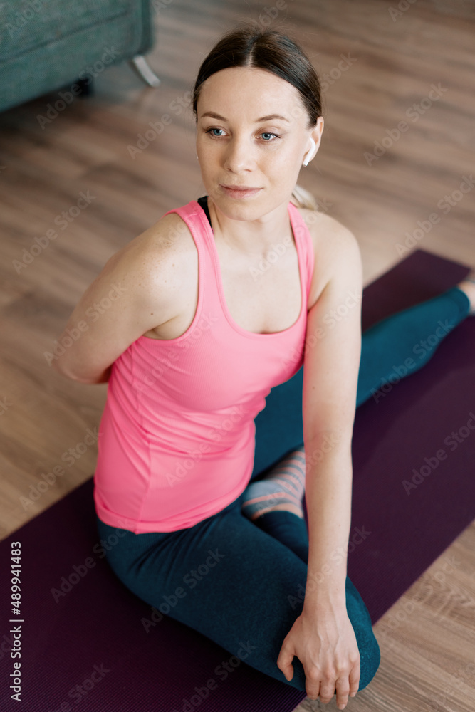 Portrait attractive woman practicing yoga at home Portrait attractive woman practicing yoga at home