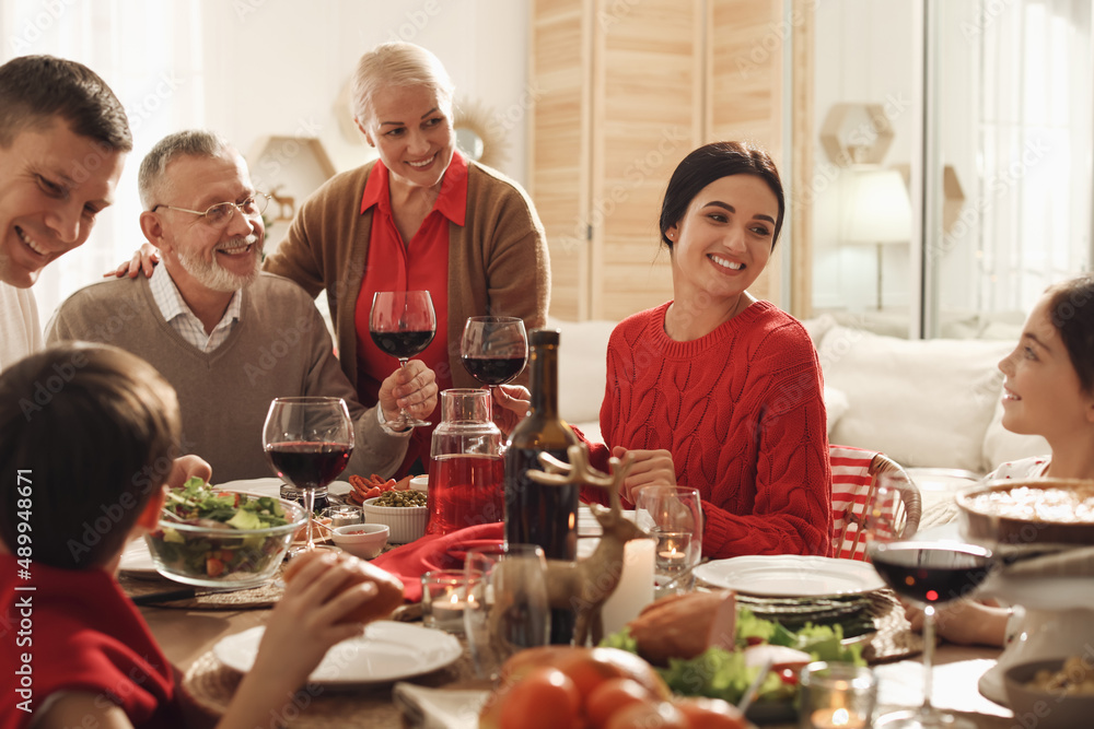 Happy family enjoying festive dinner at home. Christmas celebration