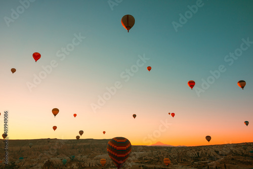 Travel to Cappadocia background photo. Hot air balloons on the sky in morning