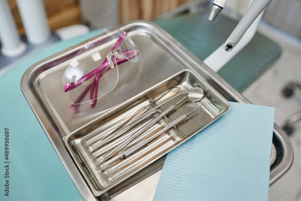 Background image of sterile metal tools on tray in modern dental clinic,  copy space Stock Photo | Adobe Stock