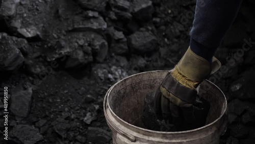 Wallpaper Mural Worker collects coal in a bucket. Torontodigital.ca