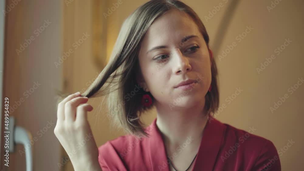 Shy Beautiful Girl Looking At The Camera And Smiling