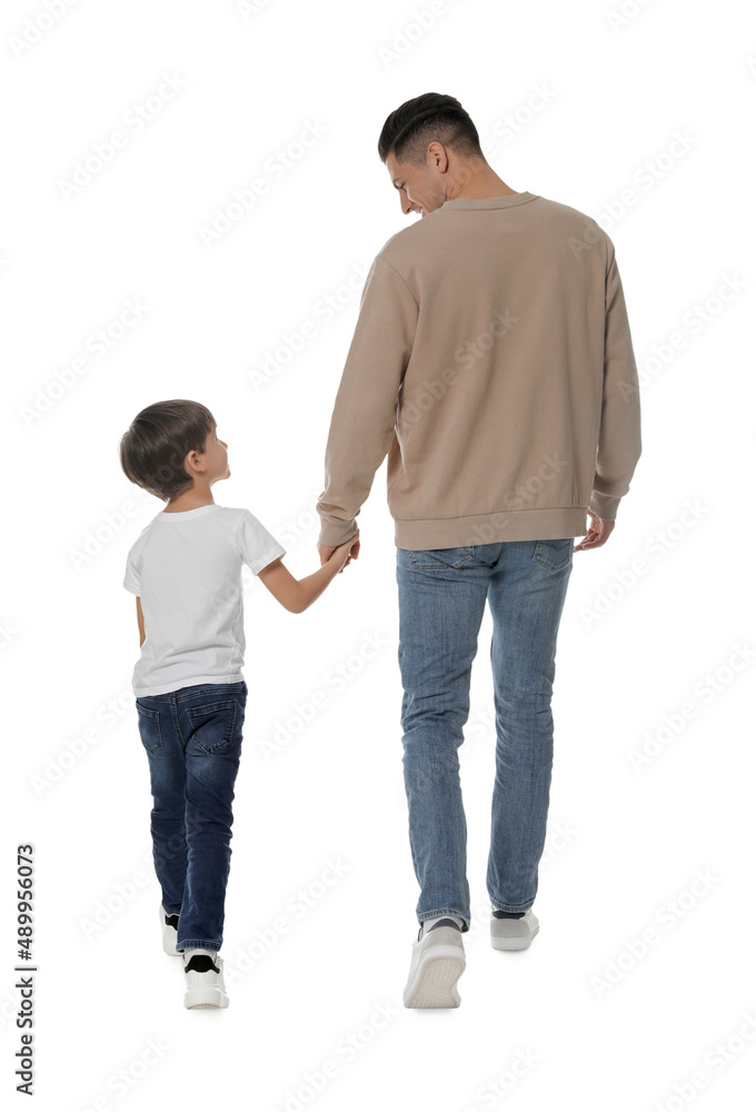 Little boy with his father on white background, back view Little boy with his father on white background, back view