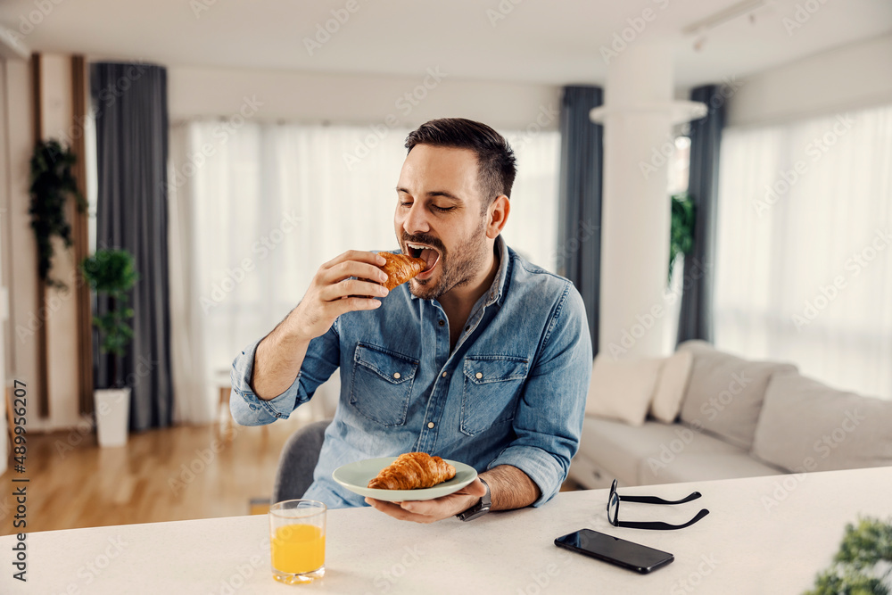 A man having breakfast at his cozy home. A man having breakfast at his cozy home.