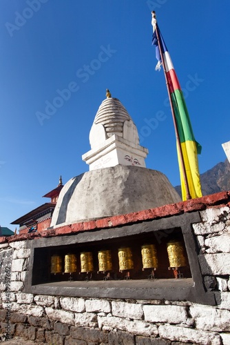 Stupa with prayer flags and wheels near Lukla
