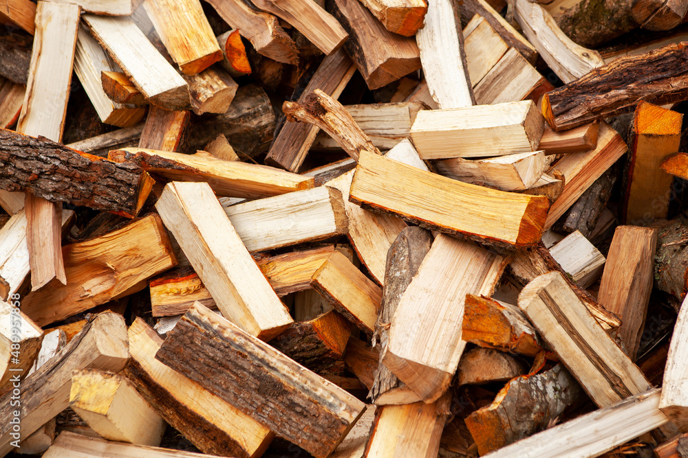Background in the form of firewood chopped for heating the house. Background in the form of firewood chopped for heating the house.