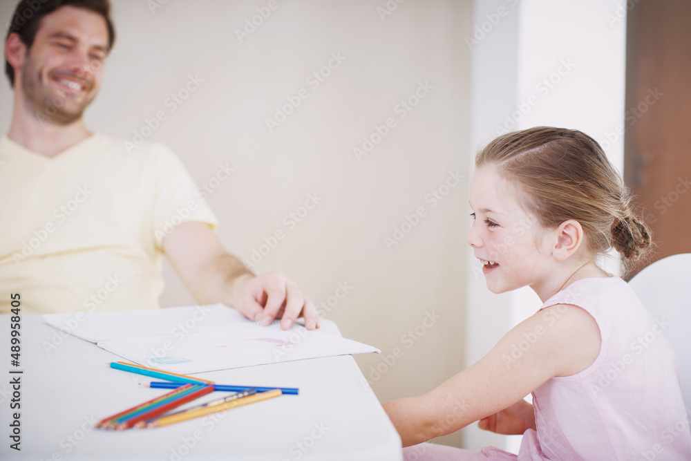 She always does her homework. Cropped shot of a little girl doing her homework. She always does her homework. Cropped shot of a little girl doing her homework.