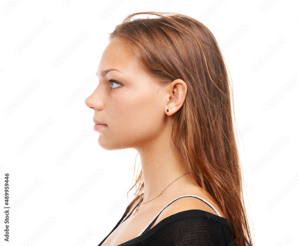 Confidence is a beautiful feature in a woman. Profile shot of an attractive young woman isolated on white. Confidence is a beautiful feature in a woman. Profile shot of an attractive young woman isolated on white.