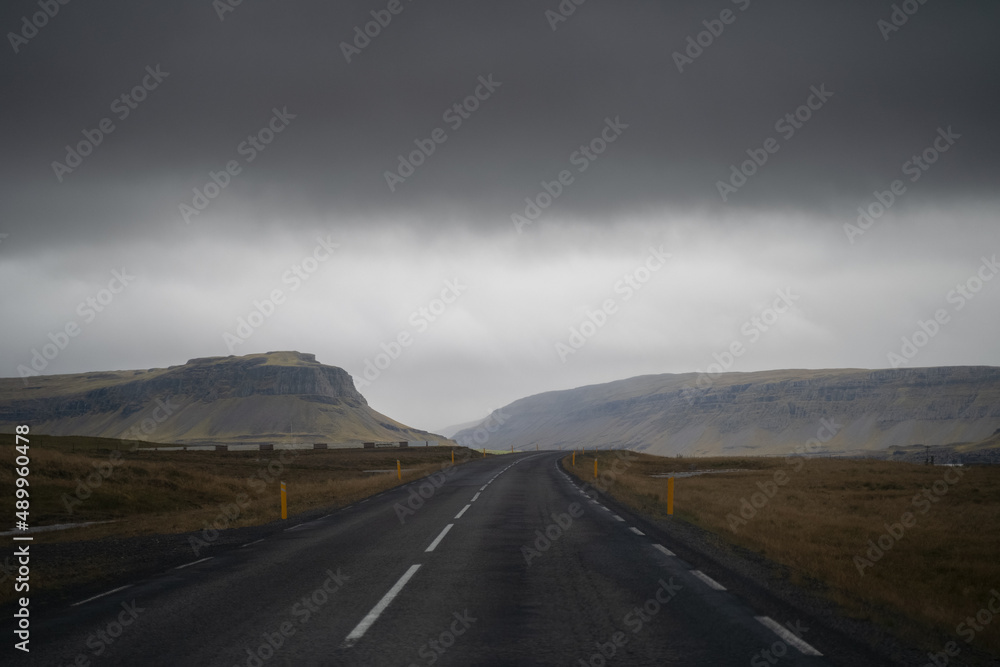 Naklejka premium Drive car on the road. Iceland travel. View from the inside. Beautiful nature icelandic landscape in the day