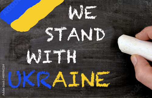 We stand with Ukraine blackboard and ukrainian colors photo