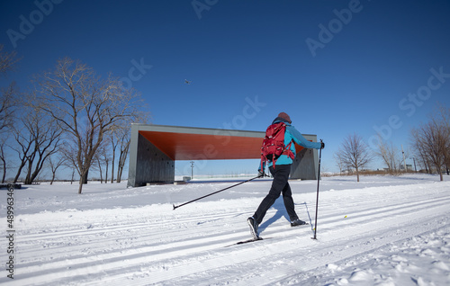 Cross country skiing in a park during winter photo