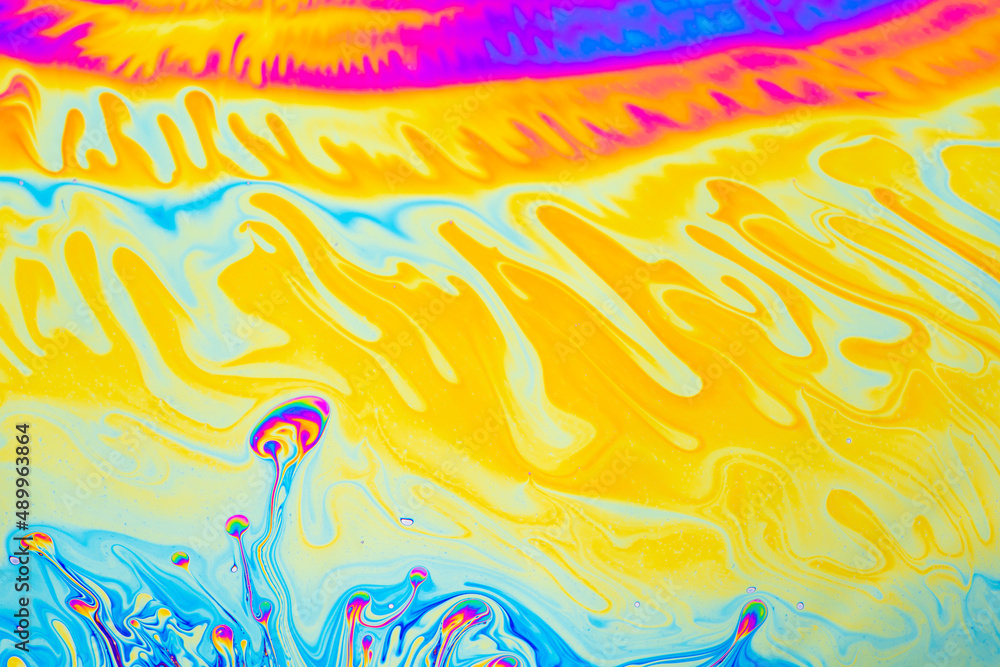 Psychedelic multicolored background abstract. Rainbow colors. patterns background. Photo macro shot of soap bubbles