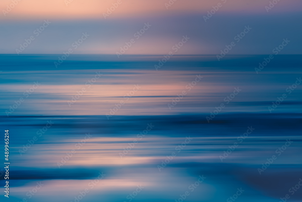 Pink sunset over the sea, abstract seascape. Soft blue and pink colors, fine art