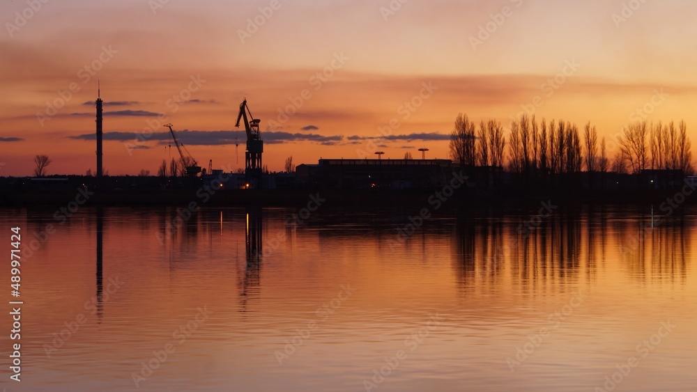 View of the Vistula River in Płock during sunset.