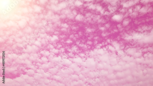pink sky Bright sunlight with natural white clouds for background or illustration.