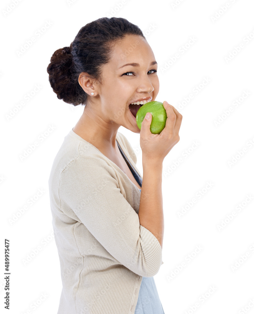 Mmm,its crispy and fresh. Young woman smiling while eating a fresh apple - isolated on white. Mmm,its crispy and fresh. Young woman smiling while eating a fresh apple - isolated on white.