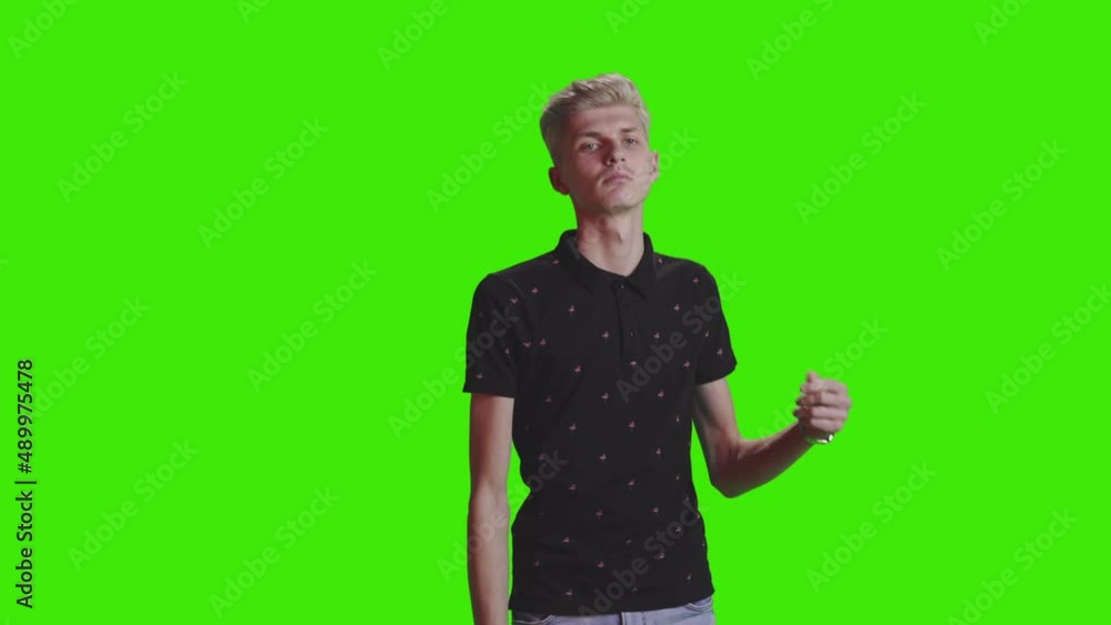 A goung teen boy is dancing and enjoying on greenscreen A goung teen boy is dancing and enjoying on greenscreen