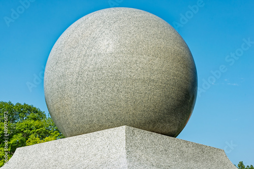 A decorative marble ball on a pedestal