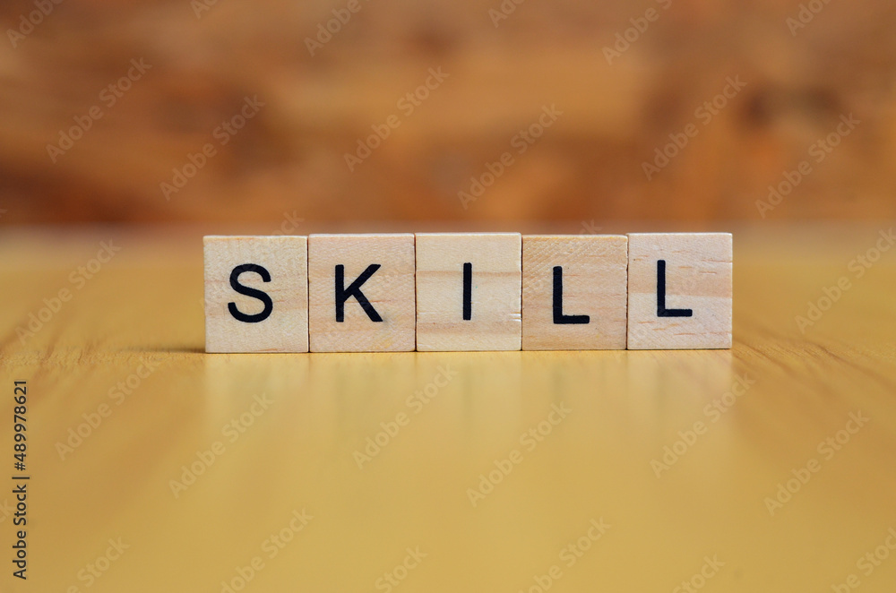 skill text on wooden square, business and motivation quotes skill text on wooden square, business and motivation quotes