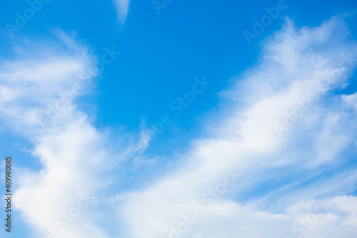 Natural daylight and white clouds floating on blue sky. Concept of freedom and relaxation.