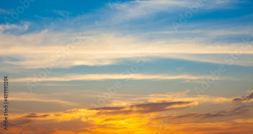 blue sky background with small clouds . © kheartmanee