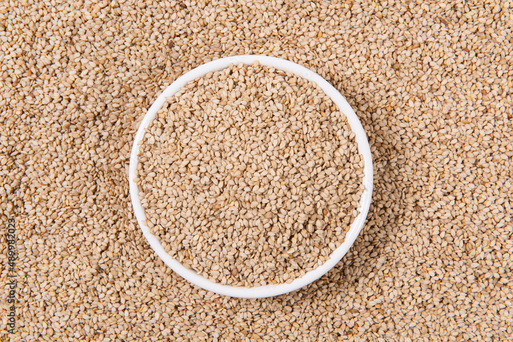 close up of sesame seeds in plate background close up of sesame seeds in plate background