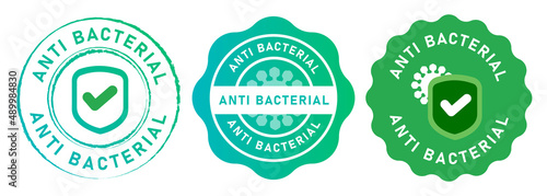 Anti bacterial microbe bacterium hygiene bacteria protection symbol shield tested check mark symbol emblem tag design in green photo