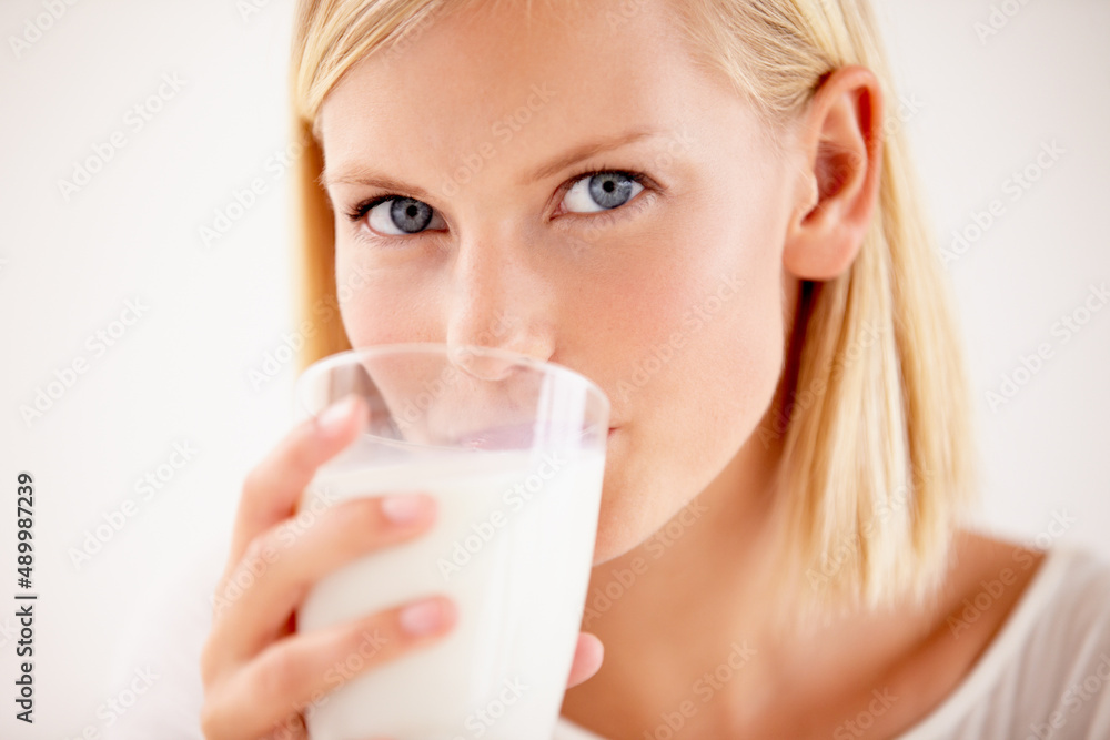 Get refreshed. Shot of a young woman enjoying a drink. Get refreshed. Shot of a young woman enjoying a drink.