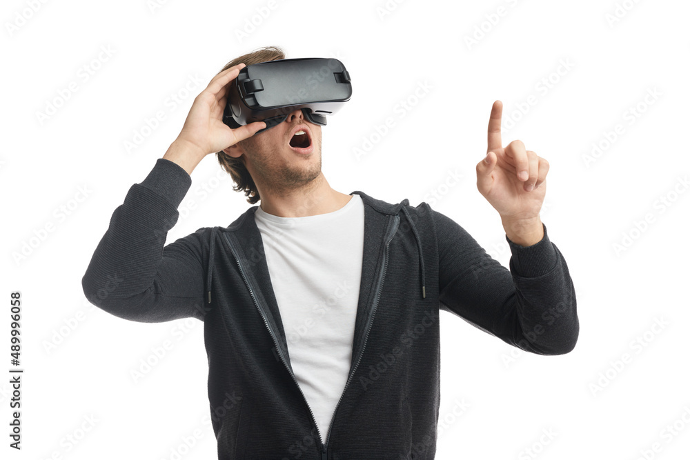 Astonished man in VR glasses interacting with cyberspace Astonished man in VR glasses interacting with cyberspace
