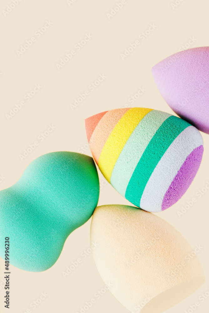 Colorful cosmetic beauty sponges close up Makeup puff for tone cream, foundation, concealer. Top view, macro. Colorful cosmetic beauty sponges close up Makeup puff for tone cream, foundation, concealer. Top view, macro.
