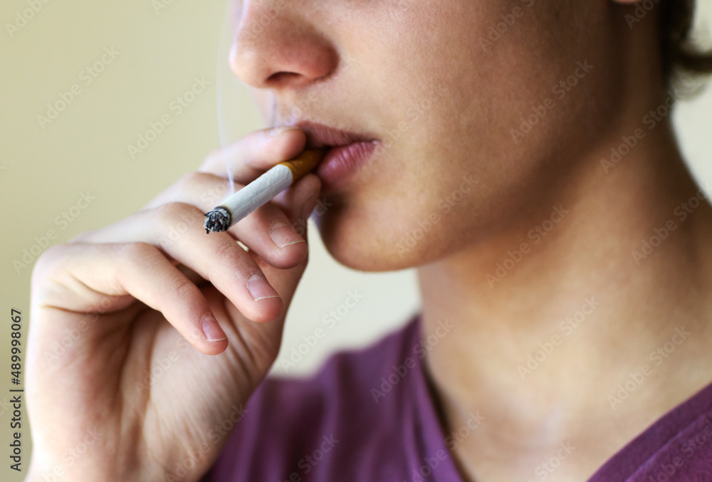 How to quit now.... Closeup of a person taking a drag from a cigarette. How to quit now.... Closeup of a person taking a drag from a cigarette.