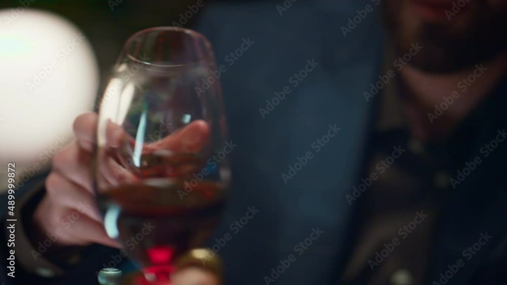 Couple clinking wine glasses in restaurant. Romantic partners enjoy dinner date Couple clinking wine glasses in restaurant. Romantic partners enjoy dinner date
