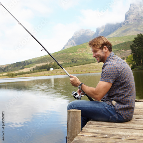 Maybe its my bait. Shot of a man enjoying a day fishing.