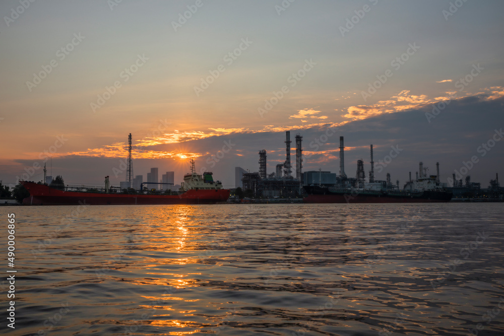 Oil refinery at dawn with sunrise sky in Bangkok ,Thailand