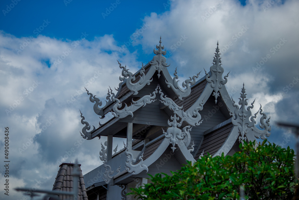 background Wat Rong Khun The White Temple and pond with fish, in Chiang Rai, Thailand background Wat Rong Khun The White Temple and pond with fish, in Chiang Rai, Thailand
