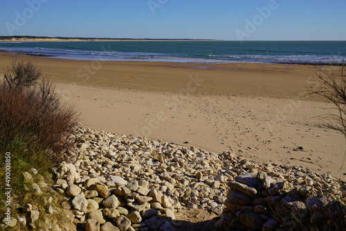 sand beach access in low tide in talmont saint hilaire vendee France photo