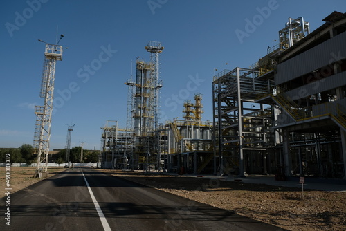Shymkent / Kazakhstan - 09.26.2018 : Tanks, pipes and metal structures at the Petro Kazakhstan oil processing plant.
