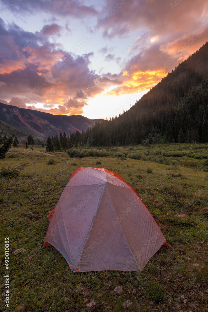 Tent camping in the Colorado mountains during sunrise