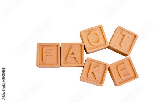 Fact or Fake Concept, Wooden Cube Change Word, April Fools Day. war concept. political concept. dishonest game. Change of facts. Illusion. Deception. The words 