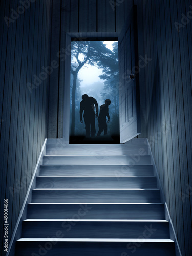 Two zombies in mysterious landscape with trees and bushes in foggy forest in the doorway