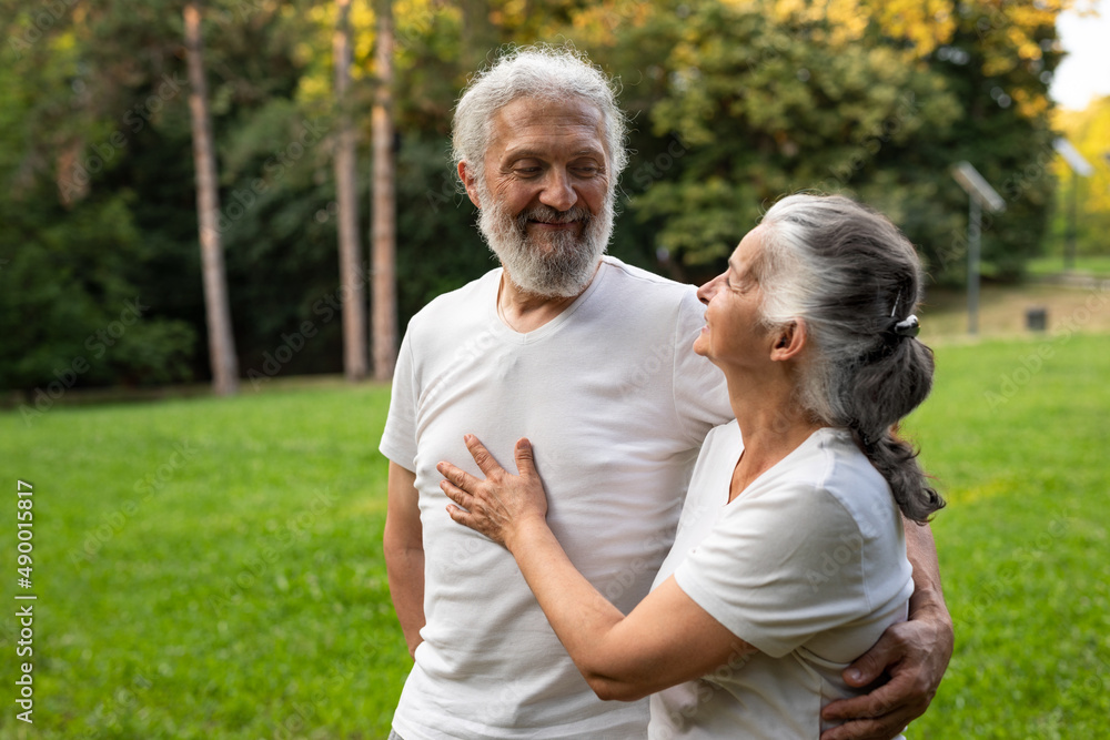 A beautiful senior couple is spending time in the nature A beautiful senior couple is spending time in the nature