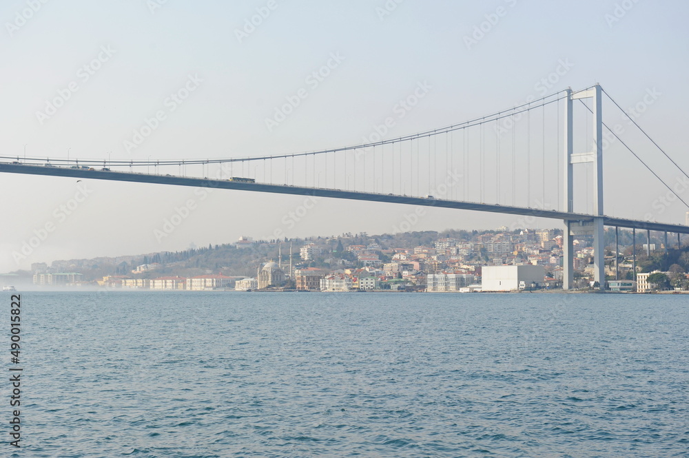 Naklejka premium Istanbul / Turkey - 02.28.2017 : Coastal zone and architecture of the Bosphorus Strait. A bridge connecting Europe and Asia.