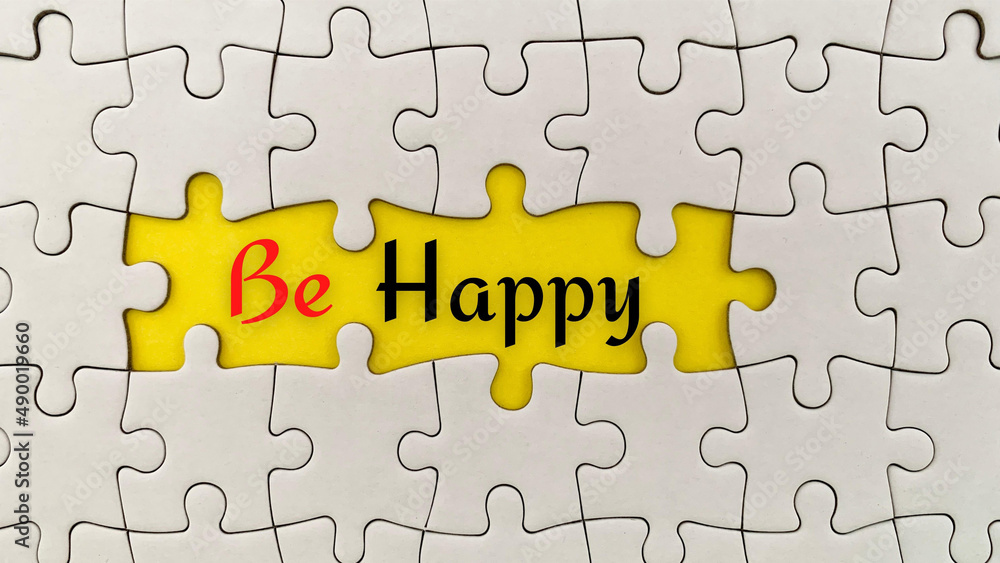 Jigsaw puzzle with text - Be happy. Conceptual Jigsaw puzzle with text - Be happy. Conceptual
