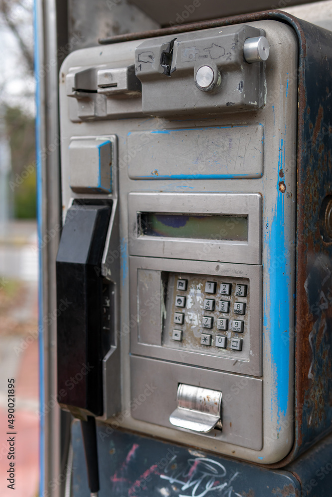Vertical photo of an old, classic and rusty Spanish phone booth in disuse. Typical phone booth of the 90s in Spain. Vertical photo of an old, classic and rusty Spanish phone booth in disuse. Typical phone booth of the 90s in Spain.