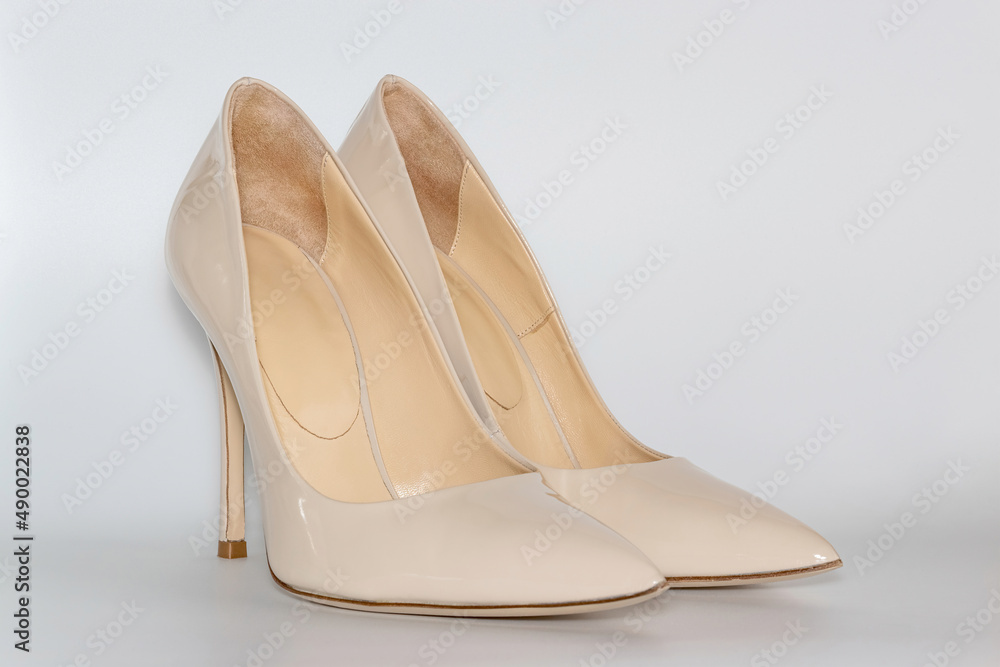 Front view of the nude colored high heeled women's shoes. Front view of the nude colored high heeled women's shoes.
